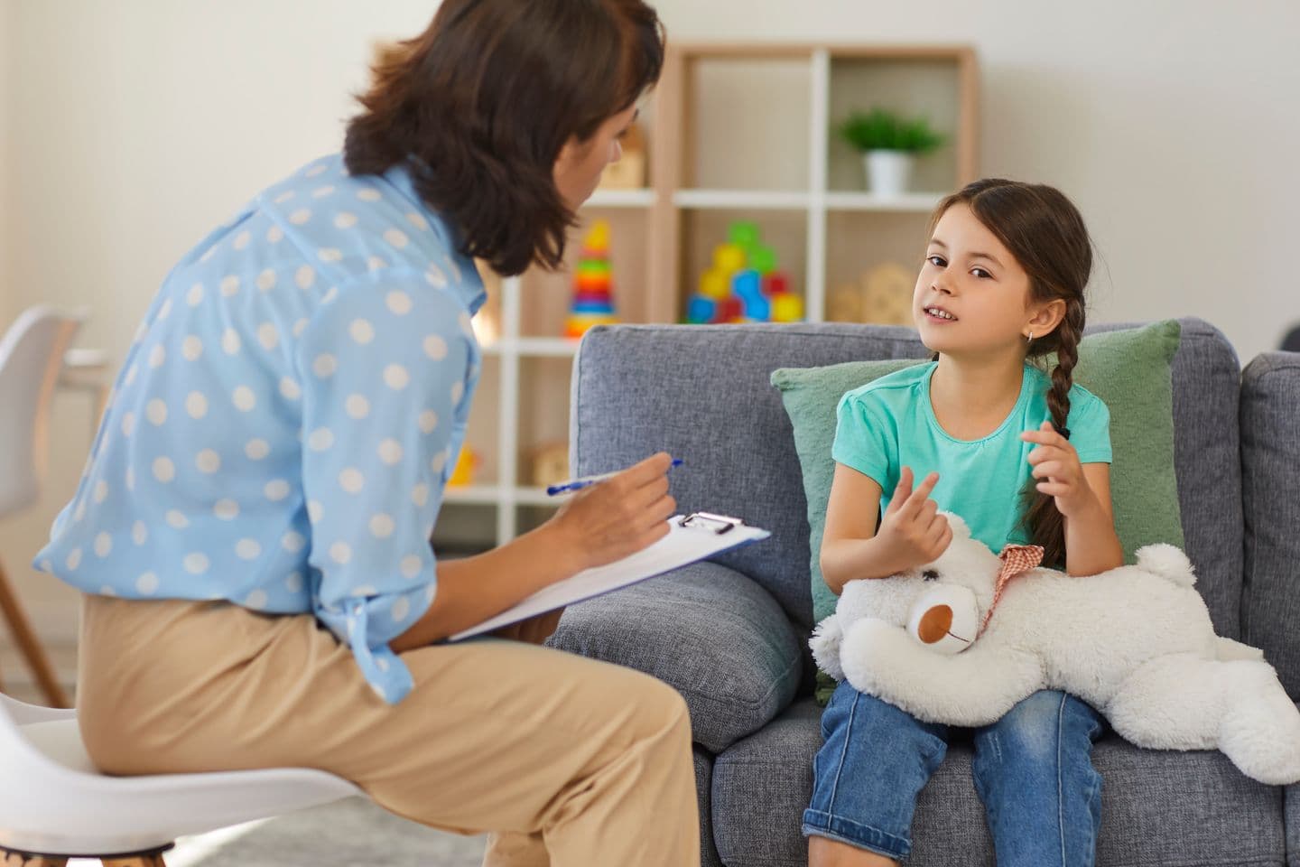 Child talking to therapist