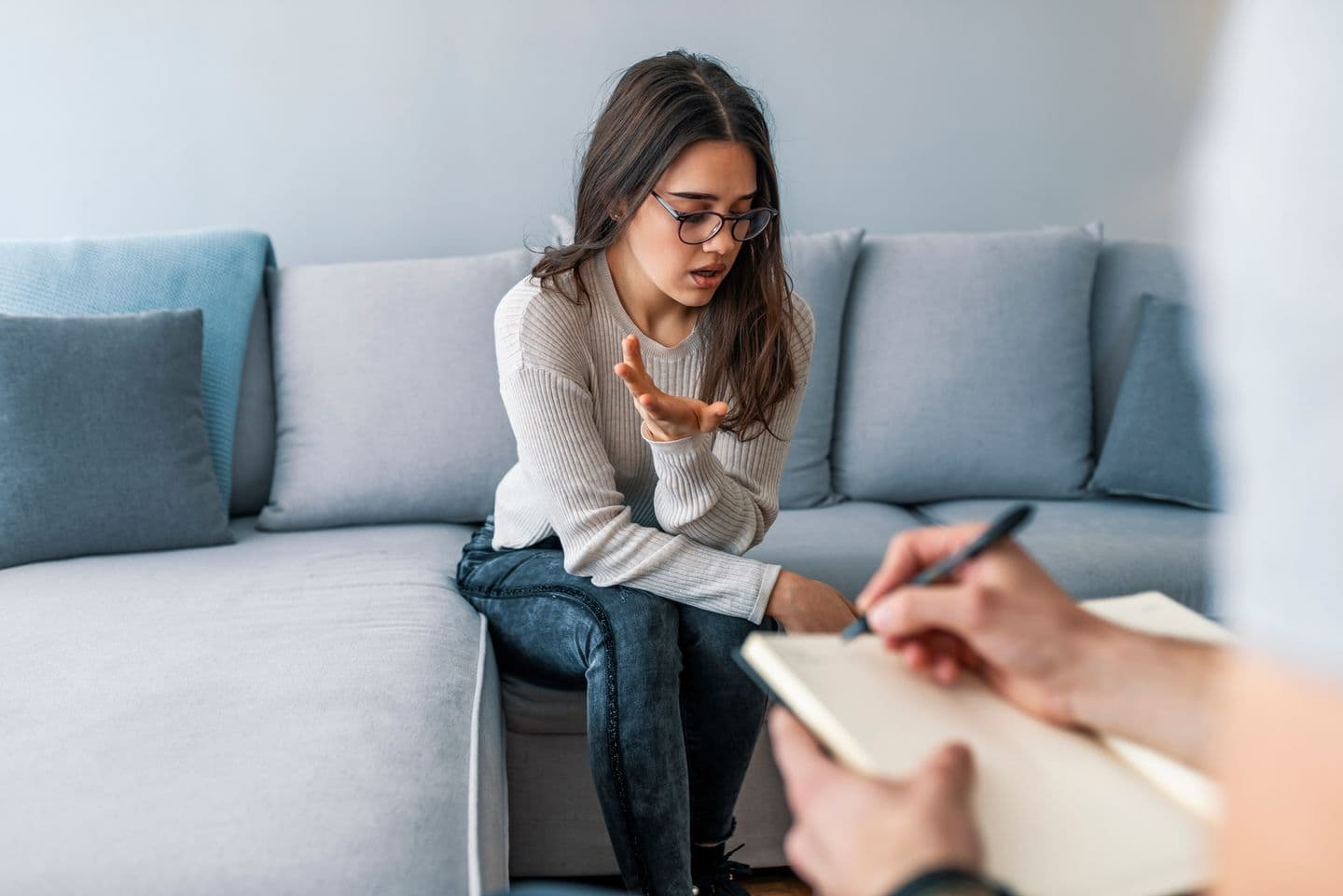 Woman sitting on a couch in a therapy session